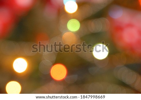 Blurred background. Bright glowing multi-colored New Year, Christmas garland out of focus. Space for an inscription.  Congratulations. Holidays. 