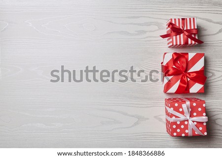 Christmas gift box  Ornaments on white wood top flat layout blank copy space for text.
