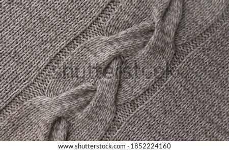hand-knitted grey with cable pattern
