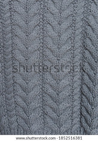 Background of blue warm knitted sweater textile