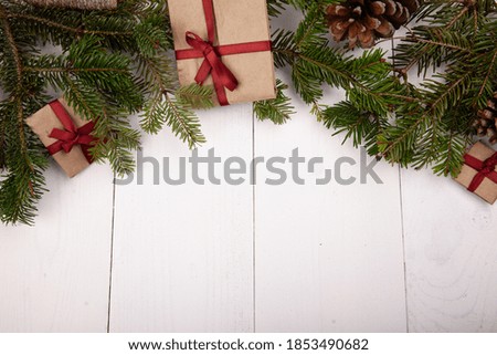 Christmas tree with handmade gifts on white wooden background. Flat lay, top view, overhead. Christmas banner mockup.