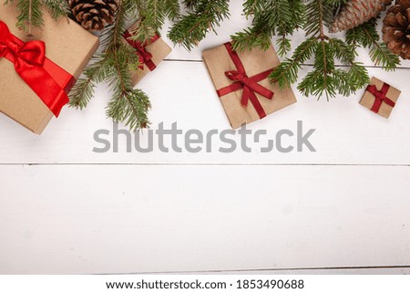Christmas tree with handmade gifts on white wooden background. Flat lay, top view, overhead.