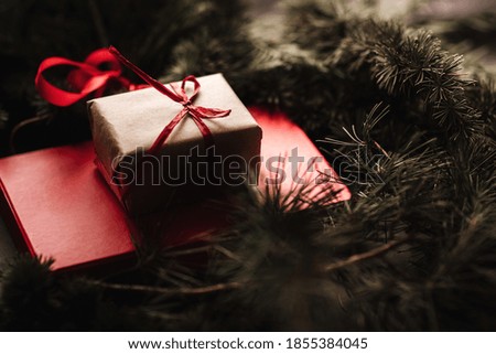 Cristmas gift with christmas wreath on the table. Christmas and New Year concept. 