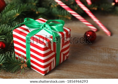 Christmas gift box on wooden table, closeup