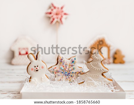 Christmas homemade gingerbread cookies on wooden table.