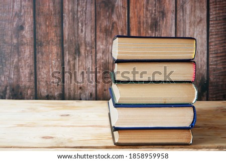 Stack of books background, many books piles