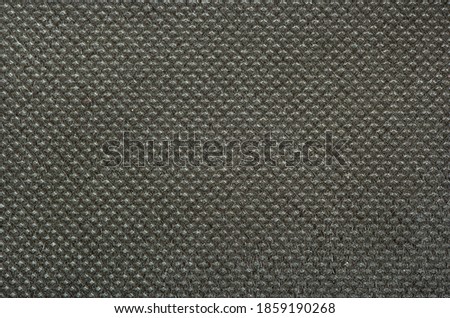 Textured dark fabric background close up