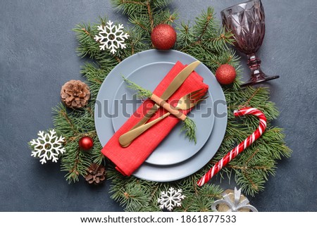 Christmas table setting on dark background