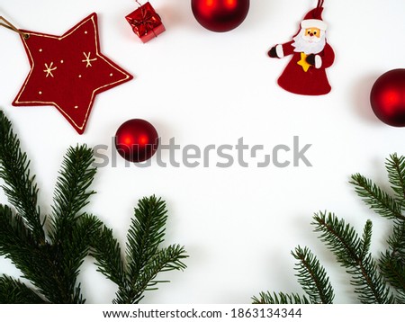 Christmas composition. Christmas decoration and fir tree branches on white background. Flat lay, top view.