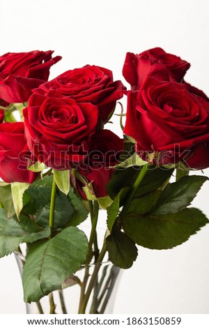 Bouquet of red roses in a glass vase
