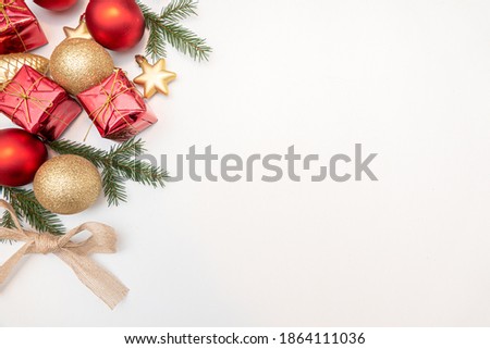 christmas gift with gold and red balls bow isolated on white background