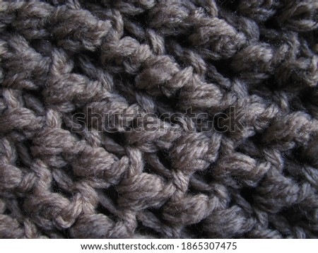  Knitted woolen texture of a large knit close-up.