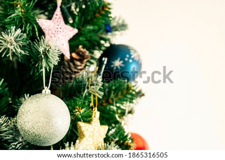 Christmas toys on Christmas trees close up and white space for text