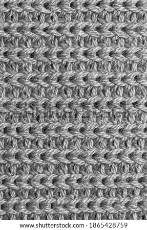Close up shot of knitted woolen fabric texture
