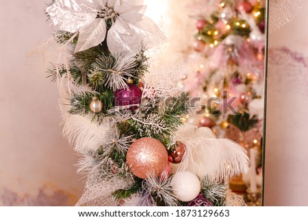 elements of decorating the Christmas tree. pink balls on the Christmas tree close