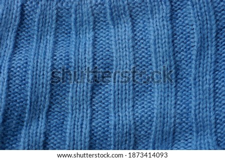 blue fabric texture of wool striped knitted garment