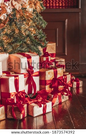 Gift boxes and traditional Christmas tree, wrapped presents and decor in colonial style as holiday home decorations