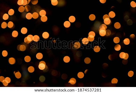 Blurred defocused orange dots background 