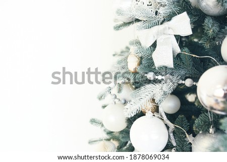 Advertising of goods and services on Christmas and new year's eve. Christmas decorations on the branches of pine needles on a white background with copy space