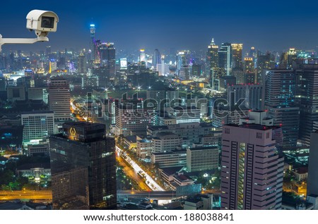 Security camera monitoring the Bangkok cityscape at twilight time.
