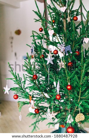 Christmas Tree With Red Ornament. Christmas decoration. Beautiful christmas tree decorated with beautiful shiny baubles. 