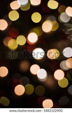 small lights garlands hanging on a white wall, taken in the evening, close-up, macro photography