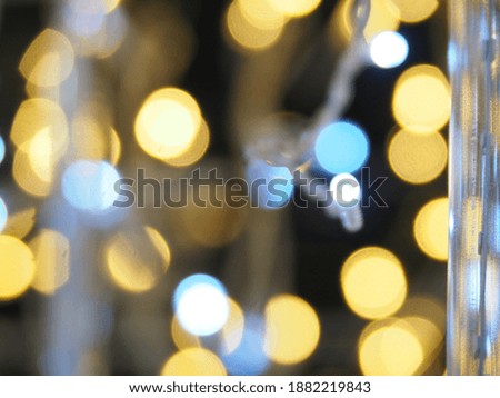 Yellow and blue bokeh on black background