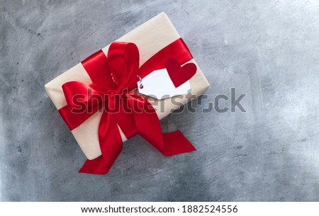 present gift box with red ribbon. Valentine's day, birthday present, mother's day concept