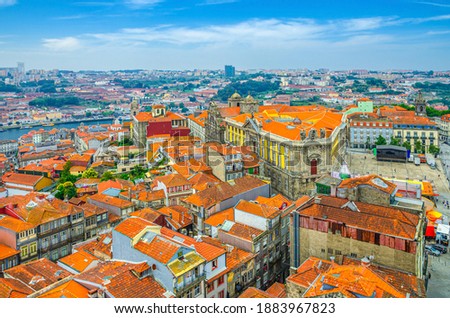 Aerial panoramic view of Porto Oporto city historical centre with red tiled roof typical buildings, Igreja de Sao Bento da Vitoria church and Vila Nova de Gaia city, Norte or Northern Portugal