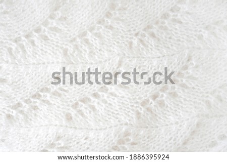 Hand knitting. Handmade wool sweater texture background.