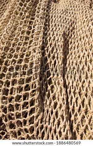 fishing net. Symmetrically knotted rope. Tissue.