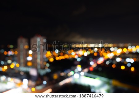 Blurred lighting city and lighting building colorful bokeh background