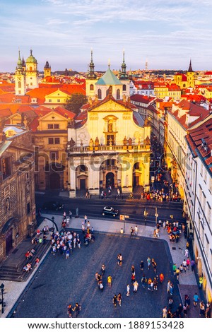 Scenic summer aerial panorama of the Old Town architecture in Prague, Czech Republic. Red roof tiles panorama of Prague old town.  Prague Old Town Square houses with traditional red roofs. Czechia.