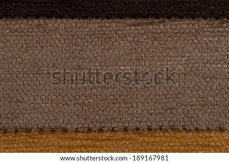 Closeup detail of brown fabric texture background.