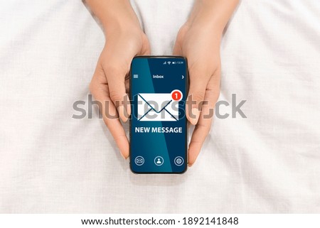 Unrecognizable Female Holding Smartphone With New Message Notification And Envelope Icon On Screen While Relaxing In Bed, Creative Collage For Newslettering Concept, Top View With Copy Space