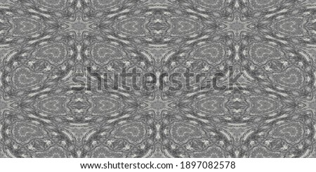 A kaleidoscope pattern formed by lines and spots of natural stone texture. Amazing natural patterns and textures of slice of brown and white minerals. The image with the mirror effect.