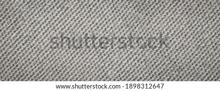 macro photo of gray cotton material. background or textura