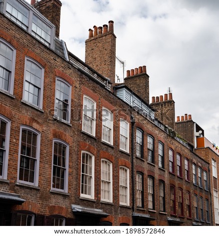 Very typical London street with brick wall houses