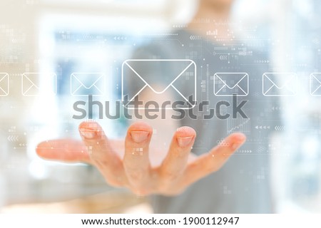 Email concept with young man holding his hand