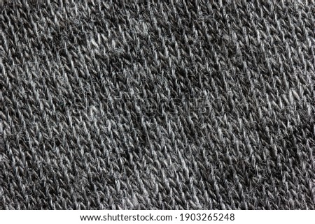 Grey cloth fabric background texture macro top view.