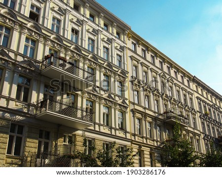 Refurbished old building facades in the green streets of the districts Prenzlauer Berg and Pankow in Berlin, Germany