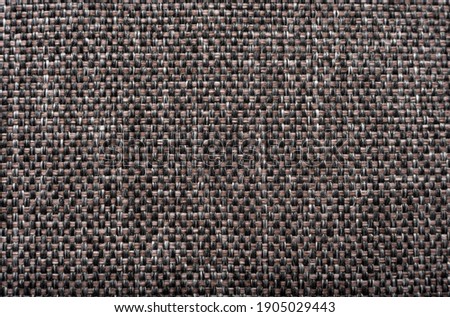 The fabric is close-up gray-black color .A piece of fabric for sewing clothes