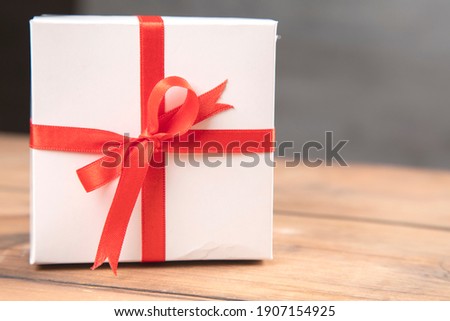 white gift box on the wooden table