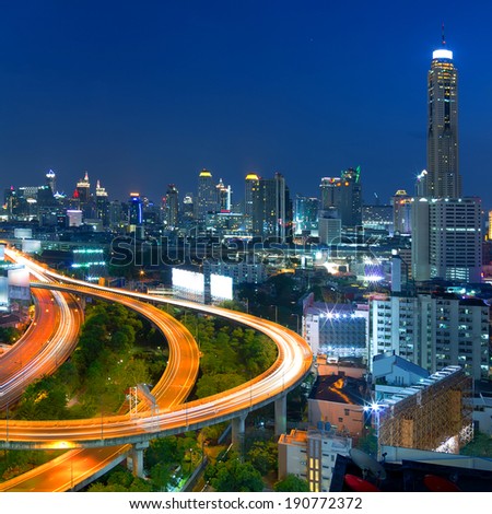 Building the business district in the evening Front elevation curves of the highway bridge in Bangkok.