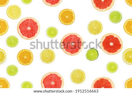 Citrus fruits background. Seamless pattern with pieces of orange, lemon, lime, grapefruit. High quality photo
