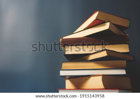 a composition of many hardcover books, a concept of reading and education, copy space