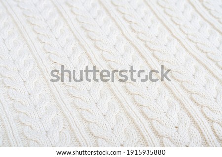 Background knitted fabric, pattern with pigtails. Studio Photo