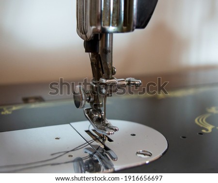 needle attachment on old sewing machine.antique sewing machine working.old tailor's old sewing machine.