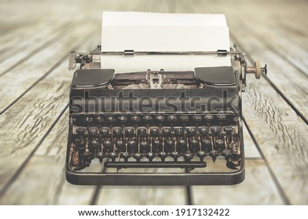 Old ancient typewriters on wooden desk
