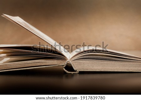 An open book lying on the table.